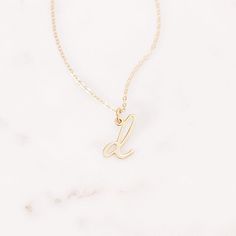 Understated and chic, the Nella Mini Initial Pendant lets you wear your initial or the initial of someone you love with a lowercase letter charm that can be worn on its own or layered with other pieces. Available in sterling silver, 18k gold plated or 18k rose gold plated silver Size: 1/4 to 1/2" (varies by letter) 16" cable chain with 2" extender Spring ring closure Made in the USA This is a lowercase only font, uppercase letters entered will be produced as lowercase This item is FINAL SALE and Dainty Initial Pendant Name Necklace With Charms, Custom Name Jewelry With Initial Pendant For Everyday, Rose Gold Initial Pendant Charm Necklace In 14k Gold, Everyday Tan Initial Pendant Charm Necklace, Elegant 14k Gold Monogram Charm Necklace, Delicate Initial Pendant Charm Necklaces, Delicate Initial Pendant Charm Necklace, Dainty Sterling Silver Monogram Charm Necklaces, Gold Sterling Silver Initial Necklace With Charms