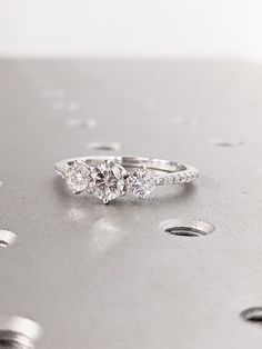 two diamond rings sitting on top of each other