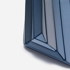 The new Sera Tall Tote is designed to carry your daily essentials, it can easily fit a large phone (like iPhone 15 Pro Max), mini wallet or cardholder, keys, lipstick, etc.Its exterior design is a surrealist dream, reminiscent of a maze-like structure protruding outwards, with sharp, clean lines, and a 3D façade. It has a suede drawstring top, securing your belongings on the go.Folding inwards like an accordion and then stretching outwards to store those last-minute belongings. The Sera Tall Tot Modern Rectangular Phone Bag, Modern Portable Rectangular Phone Bag, Modern Blue Bags With Interior Card Slots, Modern Phone Bag With Removable Pouch, Modern Square Phone Bag With Cell Phone Pocket, Modern Leather Phone Bag With Card Slots, Modern Office Bag With Card Slots, Modern Office Bags With Card Slots, Modern Office Phone Bag Rectangular