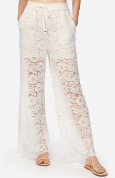 These mostly-sheer lace pants with a wide-leg silhouette give off that perfect boho vibe. 29" inseam; 23 1/2" leg opening; 11 1/2" front rise; 17 3/4" back rise Elastic/drawstring waist Front slant pockets Partially lined 60% nylon, 40% cotton Dry clean Imported Elegant Lace Bottoms With Elastic Waistband, Chic Wide Leg Lace Pants, White Lace Bottoms With Elastic Waistband, Spring Trousers With Lace Trim, Chic Lace Pants With Lace Trim, Elegant Wide Leg Lace Pants, Wide-leg Lace Pants With Lace Trim, Chic Lace Wide Leg Bottoms, Wide Leg Lace Pants With Lace Trim