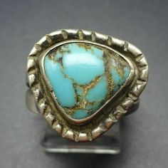 "VINTAGE NAVAJO RING DESCRIPTION: This delightful old ring will be a treasured addition to your collection of fine vintage Native American jewelry. MEASUREMENTS: Ring face measures 3/4\" x 5/8\" RING SIZE: 8 3/4 WEIGHT: 6.2 grams SIGNED: no STERLING: unmarked, verified sterling silver"