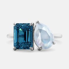 The December birthstone London Blue Topaz is a blue gemstone that is said to promote truth, wisdom, and clear communication. It is believed to help balance the mind, body, and spirit. Combine two birthstones to create your personal Toi-et-Moi Ring, which symbolizes the bond between you and the special person in your life. Features: London blue topaz gemstone Two-stone design 14k yellow gold Fine Quality AA Grade Gems Luxury Topaz Birthstone Ring For Weddings, Blue Gemstones With Accents For Wedding, Blue Wedding Birthstone Gemstones, Blue Topaz Gemstone Ring For Promise, Blue Birthstone Gemstones For Wedding, Fusion Style Moonstone Gemstone Ring For Anniversary, Fusion Style Anniversary Moonstone Gemstone Ring, Anniversary Fusion Style Moonstone Gemstone Ring, Anniversary Fusion Style Moonstone Ring