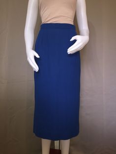 1980s textured pencil skirt Midi length, pleated for fit Take blue color Sits at smallest part of waist Blue Midi Length Pleated Skirt For Workwear, Elegant Blue Midi-length Pleated Skirt, Chic Blue Pleated Skirt For Formal Occasions, Elegant Blue Fitted Pleated Skirt, Classic Blue Pleated Bottoms, Blue Lined Midi Pleated Skirt, Blue Pleated Formal Bottoms, Blue Pleated Midi Skirt With Lining, Blue Midi Length Lined Pleated Skirt