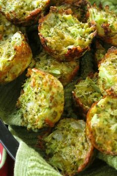 broccoli and cheese muffins on a green cloth