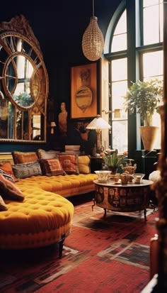 a living room filled with lots of furniture next to a large window covered in mirrors