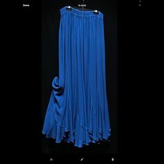 Moroccan Cotton Rayon Blend Blue Stretch Maxi Skirt For Spring, Blue Flowy Bottoms, Chic Blue Maxi Skirt With Relaxed Fit, Chic Flowy Blue Skirt, Chic Flowy Blue Bottoms, Chic Blue Stretch Maxi Skirt, Blue Flowy Skirted Bottoms, Flowy Blue Maxi Skirt With Lining, Elegant Blue Stretch Maxi Skirt