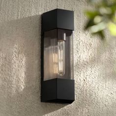 an outdoor light mounted on the side of a building