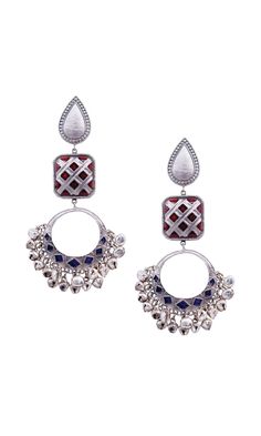 The royal earrings are a beauty to behold with its detailed work and ultra-magnificence. The delicate miniature ghungroos just add to the drama and extravagance. The blue and maroon enamel chaand and silver chains are a festive essential. Inspired by Mughal art and architecture, this piece was created to bring a majestic appeal to your occasions and to bless those subtle, graceful cholis and sarees beautifully. Silver Fusion Style Metal Danglers, Silver Metal Fusion Danglers, Silver Fusion Danglers Made Of Metal, Silver Kundan Fusion Danglers, Silver Metal Chandbalis For Festive Occasions, Silver Metal Fusion Chandbalis, Fusion Style Sterling Silver Chandbali Danglers, Silver Fusion Style Chandbalis, Silver Meenakari Danglers