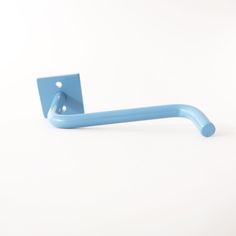 a blue toothbrush holder on a white surface with a light blue handle for the toothbrush