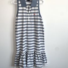 Brand New Striped Girls Polo Dress In Perfect Condition! Preppy Navy Cotton Dress, Preppy Striped Cotton Dress, Blue Cotton Preppy Dress, Preppy Blue Cotton Dress, Preppy Blue Ruffled Dresses, Preppy Blue Dresses With Ruffles, Preppy White Ruffled Dress, Casual Blue Dress With Striped Hem, White Summer Dress With Striped Hem