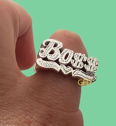 Boss Name ring in Gold, Silver or Two tone style is a perfect statement ring for you.  **COLOR** Gold and Rhodium overlay.( Silver accent, first letter) Rose over silver. Plain silver. 10k gold 14k gold **SIZES** From 3/4'' to 1 '' depends on the name. Name size is going to be adjusted accordingly by a ring size. I am able to do men sizes from US 7 to 13. Large size is $12 more.(Over size 14-15). HOW IS THE RING MADE? We use sterling silver .925 to create our beautiful rings for you. All our cus Personalized Silver Diamond Ring In 14k Gold, Silver Nameplate Rings For Anniversary, Custom Name White Rings For Anniversary, Custom Name White Promise Ring, Custom Name Initial Ring In 14k Gold And Silver, 14k Gold Silver Initial Ring With Custom Name, Customized Nameplate Rings For Anniversary, White Gold Name Ring Jewelry, White Gold Name Rings