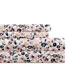 three sheets in pink and black floral print with gold accents on the bottom, one is folded