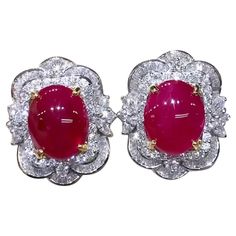 A pair of exquisite earrings feature a stunning design in Art Deco style, so delicate gems and brilliant diamonds. Crafted with refined details, the soft and feminine design adds a touch of elegance to any ensemble . The combination of the radiant red rubies and sparkling diamonds creates a dazzling and sophisticated look. Gorgeous earrings come in 18k gold with 2 pieces of Natural Burma Rubies, extra fine quality, spectacular color, in perfect oval/cabochon cut , of 11,00 carat, and 174 pieces of Natural Diamonds, in baguettes and round brilliant cut, of 3,60 carats, F color VS clarity, so bright diamonds. Handcrafted by artisan goldsmith. Excellent manufacture and quality of gems. Complete with AIG report. Whosale price. Note: no taxes on my shipment. Blink Blink, Radiant Red, 18k Gold Earrings, Oval Earring, Estilo Art Deco, Flower Tops, Feminine Design, Ruby Diamond, Brilliant Diamond