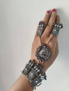 This beautiful oxidized Haath Phool is a part of Indian bridal jewelry.  This Indian ethnic Haath Phool comes with an attached adjustable Ring Haatphools are back in fashion after a very long time and have returned with a bang. This piece of oxidised black polish haathphool consists of a bracelet & a rink which is joined by chains. This gives off a very elegant & royal look if you pair it up with any outfit. We generally see brides wearing haatphool & this piece of Indian jewelry is very occasio Bohemian Style Toe Ring For Festivals, Bohemian Toe Ring For Festivals, Bohemian Festival Toe Ring Jewelry, Metal Jewelry For Rituals And Festivals, Handmade Metal Bohemian Body Jewelry, Handmade Bohemian Metal Body Jewelry, Bohemian Style Festival Toe Ring, Unique Oxidized Finish Jewelry For Festival, Unique Oxidized Jewelry For Festival