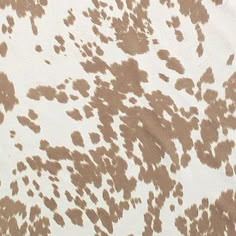 an animal print is shown in brown and white