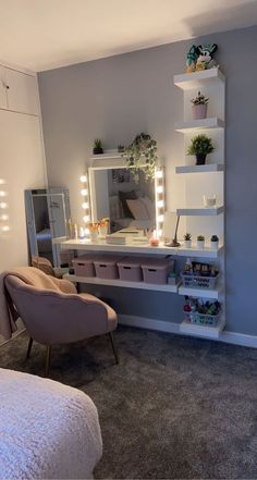 a bedroom scene with focus on the dressing table and chair, lighted by fairy lights