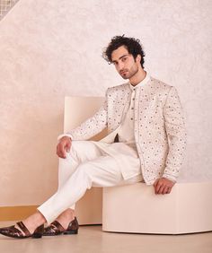 Editor's Note Featuring Kashmiri Jamawar Hand Embroidered Short Jacket. Paired With Short Kurta And Tapered Trousers. Fabric: Linen Silk Color: Ivory Component: Jacket, Kurta, Trousers Care: Dr... Traditional Festive Outerwear For Work, White Fitted Blazer For Festive Occasions, Embroidered Long Sleeve Bandhgala For Work, Fitted Embroidered Beige Bandhgala, Fitted Long Sleeve Beige Bandhgala, Fitted Beige Long Sleeve Bandhgala, Cream Fitted Long Sleeve Nehru Jacket, Beige Fitted Long Sleeve Bandhgala, Tailored Cream Outerwear For Wedding