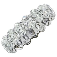 Exquisite Vivid Diamonds eternity band crafted in Platinum, showcasing 17 stunning GIA certified oval diamonds weighing 5.35 carats total, D-E color, VVS-VS clarity. Each diamond was carefully selected, perfectly matched and set in a seamless sea of eternity, creating a spectacular symphony of brilliance and fire. This sensational band measures 5.3 mm in width. It weighs 6.4 grams and is a size 7. This spectacular band was designed to sit low on the finger for maximum comfort. Our pieces are all 7 Carat Diamond Ring, Asher Cut Diamond, Oval Eternity Band, Memory Ring, Engagement Rings Romantic, Modern Wedding Rings, Emerald Cut Diamond Ring, Asscher Cut Diamond, Expensive Jewelry Luxury