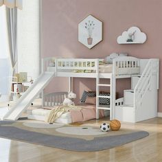 a child's bedroom with a bunk bed and stairs in the corner, along with a rug on the floor