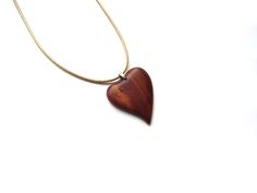 Hand Carved Wooden Heart Necklace This necklace is made from the plum wood, comes with cord of 20 inches (50 cm) in length. Heart length: 1,6 inches (4 cm) Wide: 1,4 inches (3,5 cm) * Wood color vary slightly Do not hesitate to contact with any additional questions. Custom orders are also welcomed if you would like a particular size, shape, color etc. I can gladly make an item suited to your wishes. Brown Heart Charm Necklace As A Gift, Brown Heart Charm Necklace As Gift, Heart-shaped Brown Necklace For Gift, Brown Heart Charm Necklace For Gift, Brown Necklace With Heart Charm For Gift, Brown Heart-shaped Necklace For Gift, Brown Heart-shaped Necklace For Valentine's Day, Brown Heart Pendant Necklace For Valentine's Day, Brown Heart Necklace For Valentine's Day