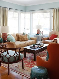 a living room filled with lots of furniture and pillows on top of it's walls