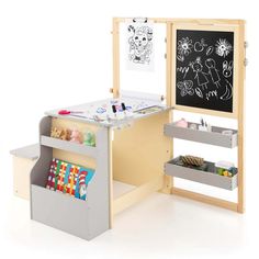 a child's desk and chalkboard set up in front of a white background