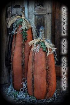 three large pumpkins are sitting on hay