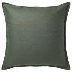 a green pillow on a white background