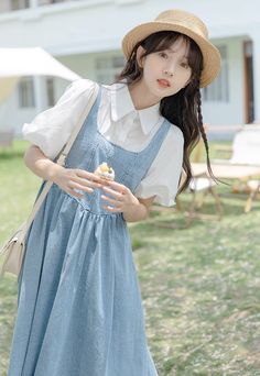 Faux two-piece layered dress with a medium wash denim bodice with white button up blouse and short puff sleeves. Concealed side zipper. S: 30.5" chest, 27.5" waist, 43" lengthM: 32" chest, 29" waist, 43" lengthL: 33.5" chest, 30.5" waist, 43.5" lengthXL: 35" chest, 32" waist, 43.5" length Mid-length Cotton Denim Dress, Spring Blue Dress With Doll Collar, Mini-length Cotton Denim Dress With Buttons, Medium Wash Cotton A-line Denim Dress, Medium Wash Cotton Button-up Denim Dress, White Button Up, Layer Dress, Shoe Gifts, Overall Dress