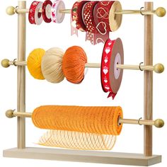 a wooden rack with yarn and spools on it