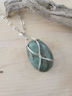 "This gorgeous pendant necklace is made from a green ocean Jasper stone.  A genuine ocean jasper I gathered from the California Coast. When you can walk with nature for hours and come away with just a few treasures you know you have selected something rare and meaningful.  How do you pass up such such a vibrant green stone? Turning a natural treasure into a piece of wearable art is almost as healing as the time spent to collect the piece.  This Pendant is made from the green Ocean Jasper, polished and wire wrapped with silver wire into a pendant and placed on an 18\" silver necklace.  This stone was hand picked from the sand and then polished by us. As this is truly natural and not polished by a manufacturing firm there maybe small rough spots in the polished finish.  Imperfect by nature. Wrapped Crystal Point, Necklace Pendent, Wire Wrapped Stone Jewelry, Stocking Stuffers For Her, Bijoux Fil Aluminium, Handmade Crystal Jewelry, Green Ocean, Jasper Jewelry, Green Jasper