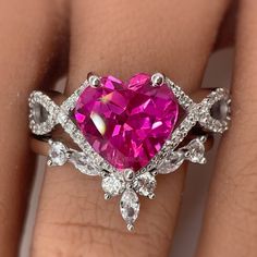 M A T E R I A L S 14k White Gold 14k Yellow Gold 14k Rose Gold S T O N E S Cruelty Free ~ Lab Pink Sapphire ~ Internally Flawless / Colorless Moissanites in Pictures * Customizable Center Stone* ~ Heart Center Stone : 3.00ct ~ Side Stones : 0.25ct total D I M E N S I O N S ~ Band: 4mm - 2mm BAND ~ Total Stones : 0.25ct total D I M E N S I O N S ~ Band: 2mm ~ Chevron V allows 3-4mm of space to pair with R I N G C A R E ~ Simple instructions to care for the ring is not expose your jewelry to chemi Vvs Clarity Round Cut Ring For Valentine's Day, Heart Cut Diamond Wedding Ring For Anniversary, Anniversary Heart Cut Diamond Wedding Ring, Moissanite Heart Cut Diamond Ring For Valentine's Day, Diamond Cut Heart Ring For Anniversary, Heart-shaped Diamond Cut Ring For Anniversary, Heart Cut Moissanite Wedding Rings, Valentine's Day Wedding Diamond Ring With Diamond Cut, Valentine's Day Anniversary Rings With Prong Setting