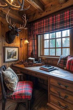 a room with a desk, chair and deer head mounted on the wall above it