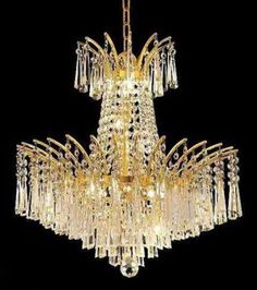 a large chandelier with many lights hanging from it's sides and bottom