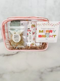 the merry birth gift box is packed with its contents and it's packaged in a pink case