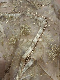 This is a Dupatta made on orders. It is made using golden color net fabric with gold sequine embroidery all over. We stitch a beautiful golden lace to all sides of it and decorate with tassels. Dupatta is having a length of 100 inches and width of around 40 inches. I don't keep it readymade I only make it exclusively for my customers. Can be fully customised. Unstitched Anarkali Set With Sequins, Sequin Lehenga For Eid Reception, Traditional Sequined Wedding Sets, Floor-length Sequin Fabric For Diwali, Eid Reception Lehenga With Sequins, Festive Traditional Wear With Sequins, Anarkali Traditional Wear With Sequins, Traditional Wear With Sequins For Festive Occasions, Traditional Floor-length Sequined Wear