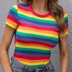 Make A Statement Without Making A Statement In This Bold And Beautiful Tee! Style: Casual Color: Multicolor Pattern Type: Rainbow Stripe Length: Regular Fit Type: Slim Fit Neckline: Round Neck Sleeve Length: Cap Sleeve Sleeve Type: Regular Sleeve Sheer: No Placket Type: Pullovers Body: Unlined Material: Polyester Composition: 95% Polyester, 5% Elastane Fabric: Slight Stretch Care Instructions: Machine Wash Or Professional Dry Clean Trendy Multicolor Color Block T-shirt, Multicolor Color Block Top For Summer, Multicolor Stretch Crew Neck T-shirt, Multicolor Short Sleeve Color Block Tops, Multicolor Color Block Crew Neck Top, Multicolor Color Block Tops For Spring, Rainbow Color Block Cotton Tops, Spring Striped Color Block Tops, Trendy Multicolor Crew Neck Top