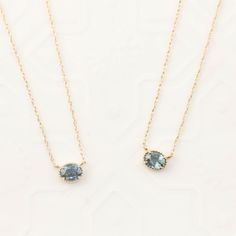 "Oval cut unheated Madagascar Sapphire approx. 4.5x3.5mm, it is not synthetic nor lab-created. Setting size: approx. 5.6x4.5mm 16\" fixed length rope chain Made of 100% recycled gold and ethically sourced gemstone Available in solid 14k yellow gold, please contact us for rose gold and white gold About This Piece Available in a choice of various blue~green shade sapphire, this delicate necklace has a touch of antique feel with milgrain design all around the sapphire. It is lightweight, ideal for Dahlia Necklace, Green Sapphire Necklace, Peacock Sapphire, Light Blue Sapphire, Blue Sapphire Necklace, Blue Green Sapphires, September Birthstone Jewelry, Solitaire Necklace, Sapphire Solitaire