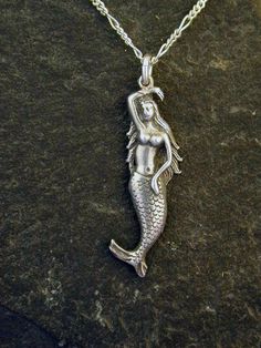 This Mermaid is Sterling Silver, The included chain is a Sterling Silver Figaro 50 chain. You may chose 16, 18 or 20 inch at the same price. Other length available at sightly higher prices. The Mermaid pendant measures 1 1/2" tall by 3/8" across. I hand cast all my pieces using the lost wax casting method. Please ask your needs. You may call me with questions, often I am out so please use my machine. 831-476-3176. Satisfaction Guaranteed!I send items USPS First Class unless otherwise directed. I Tail Mermaid, Dinosaur Pendant, Octopus Pendant, Fairies Garden, Hummingbird Pendant, Mermaid Pendant, Silver Mermaid, Wax Casting, Lost Wax Casting