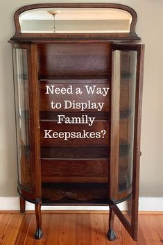 a wooden cabinet sitting on top of a hard wood floor