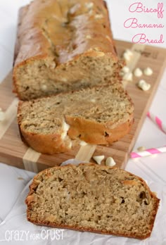 a loaf of banana bread sitting on top of a cutting board