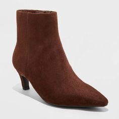 Make a statement in your cool-weather, going-out wardrobe with these Taylor Kitten Heel Ankle Boots with Memory Foam Insole from Universal Thread™. The pointed-toe silhouette showcases a faux-suede upper in a solid shade, lending classic appeal. Featuring a 2.25-inch Louis heel, these ankle boots boast a memory foam insole and soft fabric lining for added comfort. A side zipper enhances the design, providing a sleek look and a secure fit. Universal Thread™: Found exclusively at Target.