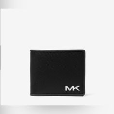 New With Tags Michael Kors Billfold Wallet Black Leather With Silver Monogram Billfold Wallet Polyurethane Blend 60% Polyurethane/20% Cotton/20% Polyester Gunmetal Hardware 4.33”W X 3.66”H X 0.75” D Interior Details: Billfold Compartments, 8 Card Slots Lining: 100% Polyester Classic Wallets With Logo For Everyday Use, Classic Michael Kors Wallet For Everyday Use, Michael Kors Leather Bifold Bag, Business Leather Wallets With Logo, Classic Michael Kors Wallets For Everyday Use, Leather Wallet With Embossed Logo For Everyday Use, Michael Kors Classic Wallets For Everyday, Leather Wallet With Embossed Logo For Daily Use, Leather Travel Wallet With Logo