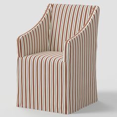 a brown and white striped chair sitting on top of a floor