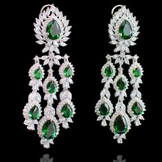 Our Irina Set has that classic vintage appeal but with a contemporary spin! Gleaming emerald and CZ stones make this set a must-have for an ultra-glamorous dose of shine. Approximate earrings length is 4". This set is available in 2 options: Necklace + Earrings Necklace + Earrings + Teekah Please select the desired option at the time of purchase. Silver-plated on high-quality brass as base metal. Made by order. Kindly allow 5-7 weeks for the delivery of this item. For custom or urgent requests, Luxury Green Chandelier Earrings For Wedding, Luxury Green Chandelier Earrings, Glamorous Green Teardrop Jewelry, Classic Emerald Jewelry For Evening, Luxury Green Earrings For Wedding, Luxury Green Bridal Earrings, Classic Evening Emerald Jewelry, Luxury Green Wedding Earrings, Green Crystal Bridal Earrings For Formal Occasions