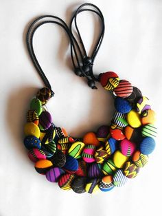 This button necklace is made with carefully selected African prints , simple and very comfortable to wear ... Fabric Necklaces, Costume Capes, African Accessories, Button Necklace, Spike Necklace, African Necklace, Fabric Necklace, Dainty Pendant, Textile Jewelry