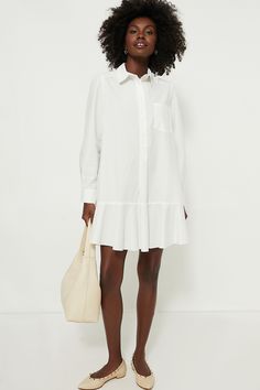 A sophisticated update to the closet staple shirt dress we love, the White Cotton Poplin Callahan perfectly merges classic and trendy. This mini seamlessly combines functional details like invisible side pockets and a button front half placket with a flirty flutter hemline to create a style that encapsulates unfussy femininity. We are pairing this tailored piece with flats or sneakers for a casual look and switching to heels when the occasion calls for it. Classic collar Long sleeves with button Timeless Shoes, White Cotton Dress, Plus And Minus, White Shirt Dress, Drop Waist, White Cotton, Cotton Poplin, Smooth Leather, Unique Style