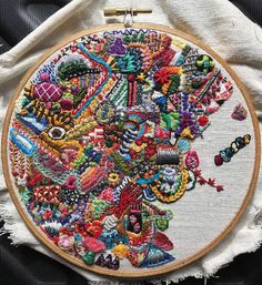 a close up of a embroidery on a piece of cloth