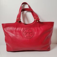 Tory Burch Bombe Red Leather Logo Tote Hand Bag Approx 17" x 9" x 4". Excellent Pre-owned Condition. Shipped with USPS ground advantage. Red Travel Bags With Gold-tone Hardware, Classic Red Bags With Leather Handles, Large Red Everyday Shoulder Bag, Large Red Shoulder Bag For Everyday, Large Red Shoulder Bag For Travel, Classic Red Shoulder Bag With Leather Handles, Large Red Shoulder Bag With Large Capacity, Leather Logo, Hand Bag