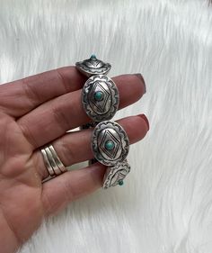 This western bracelet is concho style with little turquoise stones on the cocho for the perfect flair. It is a stretch style so it makes putting it on and off easy. Bracelet is 4" Zinc, brass, rhodium plated, stones lead compliant, nickel free to prevent tarnish. For best results, please avoid wet surfaces. This item is in stock and ready to ship same or next day from our warehouse in Rozet, Wyoming. Western Bracelets, Turquoise Stone, Rhodium Plated, Turquoise Ring, Gemstone Rings, Brass, Turquoise, Stone, Gemstones